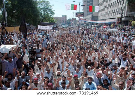 KARACHI, PAKISTAN - MAR 14: Karachi Electric Supply Company reinstated employees chant slogans against KESC administration during a protest demonstration at press club on March 14, 2011 in Karachi.