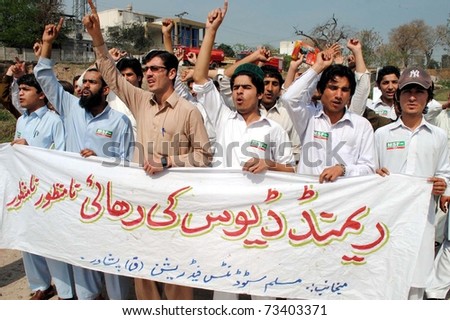 PESHAWAR, PAKISTAN - MAR 17: Activists of Muslim Students Federation-Q chant slogans against release of Raymond Davis during protest demonstration on March 17, 2011 in Peshawar.