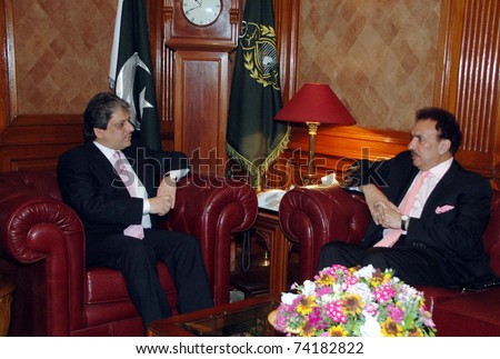 KARACHI, PAKISTAN - MAR 28: Sindh Governor, Dr.Ishrat-ul-Ibad Khan, in meeting with Federal Minister for Interior A.Rehman Malik at Governor House on March 28, 2011 in Karachi.