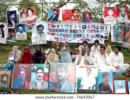 ISLAMABAD, PAKISTAN - APR 04: Residents of Balochistan are protesting for recovery of their missing lovedones during a demonstration press club on April 04, 2011 in Islamabad.