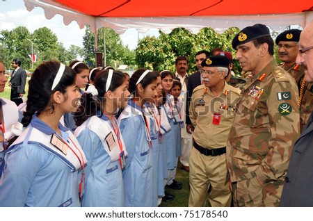TAXILA, PAKISTAN - APR 12: Chief of the Army Staff, Gen.Ashfaq Pervez Kayani, talks with students during his visits at heavy industries on April 12, 2011 in Taxila.