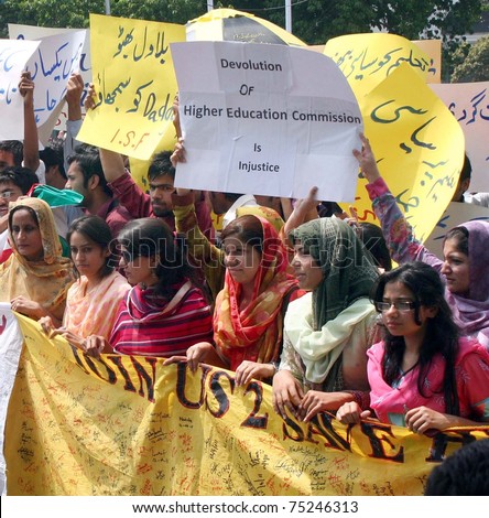 LAHORE, PAKISTAN - APR 13: Students pass through Mall road during protest rally arranged by Insaf Students Federation against devolution of Higher Education Commission on April 13, 2011 in Lahore.