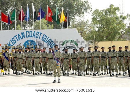 KARACHI, PAKISTAN - APR 14: Coastguard recruits present guard of honor during their passing out parade ceremony held at Pakistan Coast Guard Training Centre on April 14, 2011 in Karachi.