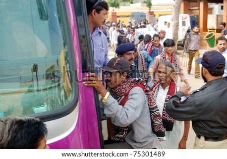 KARACHI, PAKISTAN - APR 14: Indian fishermen, who were released from jail, board on bus after their release from Malir prison on April 14, 2011 in Karachi.
