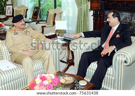 ISLAMABAD, PAKISTAN - APR 19: Prime Minister, Syed Yousuf Raza Gilani talks with Joint Chiefs of Staff Committee (JCSC) Chairman, Gen.Khalid Shamim Wayne during meeting on April 19, 2011 in Islamabad.
