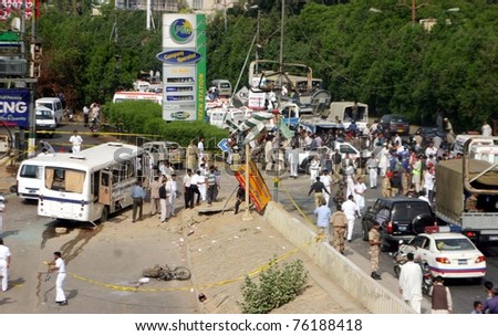 KARACHI, PAKISTAN - APR 28: Soldiers cordon off the site of explosion after planted bomb explosion at Karsaz Road on April 28, 2011 in Karachi, Pakistan.