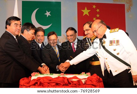 ISLAMABAD, PAKISTAN - MAY 09: Asif Ali Zardari cuts cake during ceremony to celebrate the Sixtieth Anniversary of the establishment of Pak-China Diplomatic Relations on May 09, 2011 in Islamabad.