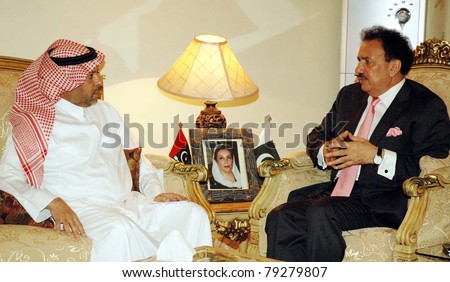 ISLAMABAD, PAKISTAN - JUN 14: Federal Minister for Interior, A.Rehman Malik talks with Abdul Aziz bin Ibrahim Al- Ghadeer Ambassador of Saudi Arabia, during meeting on  June 14, 2011 in Islamabad.