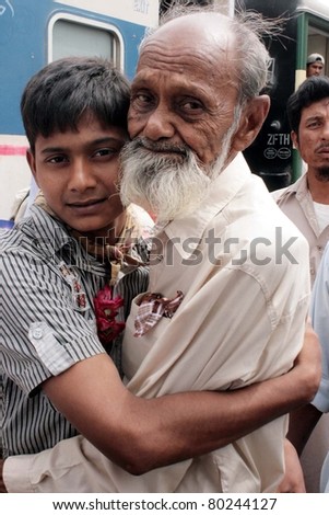 KARACHI, PAKISTAN - JUN 30: A released fisherman, who was released by Indian Government, being welcomed by his relative when he came out from passenger train on June 30, 2011in Karachi.