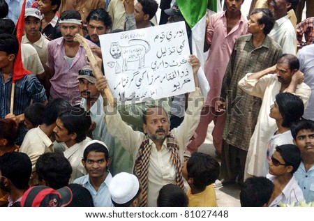 HYDERABAD, PAKISTAN - JUL 14: Supporters of Muttehda Qaumi Movement are protesting against Peoples Party Senior Leader, Dr.Zulfiqar Mirza?s statements against MQM on July 14, 2011 in Hyderabad, Pakistan.