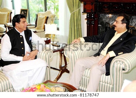 ISLAMABAD, PAKISTAN - JUL 17: Prime Minister, Syed Yousuf Raza Gilani being briefed by MNA Raja Pervez Ashraf on the Development Projects in Rawalpindi region on July 17, 2011in Islamabad, Pakistan.