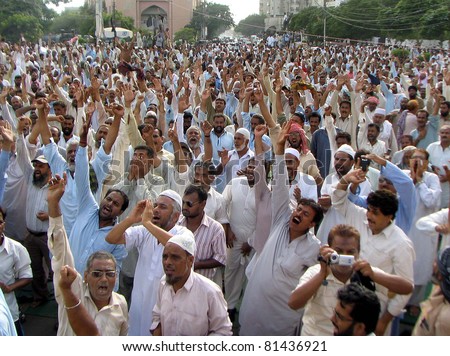 KARACHI, PAKISTAN - JUL 21: Dismissed employees of electric supply company (KESC) are protesting for restoration of their jobs during demonstration at Governor House on July 21, 2011in Karachi, Pakistan.