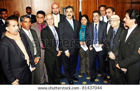 LONDON, UK - JUL 21: Prime Minister, Syed Yousuf Raza Gilani in a group photo with the Pakistani Journalists during meeting in London on Thursday, July 21, 2011.