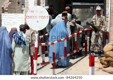 CHAMAN, PAKISTAN-SEPT 07: Army soldiers take body search of people as security has been tightened at Pak-Afghan border after twin blasts in Quetta, in Chaman September 07, 2011.