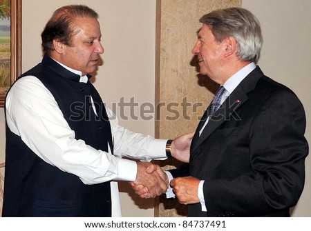 ISLAMABAD, PAKISTAN - SEPT. 15: Muslim League-N President, Nawaz Sharif shakes hand with France Ambassador, Daniel Jouanneau during meeting in Islamabad, Pakistan on September 15, 2011.