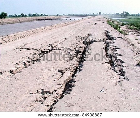 UBAURO, PAKISTAN - SEPT 17: A view of cracks at safety wall of Reni Canal due to recent heavy downpour of Monsoon season needs the attention of concerned department on September 17, 2011 in Ubauro.