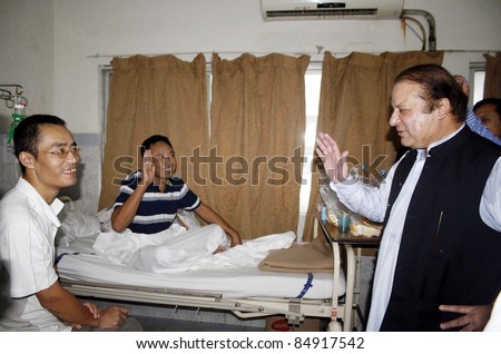 LAHORE, PAKISTAN - SEPT 17: Muslim League-N President, Nawaz Sharif inquires about the health of Dengue patients during his visits at Jinnah hospital in Lahore on September 17, 2011.