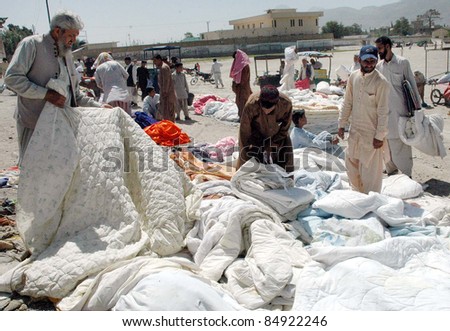 QUETTA, PAKISTAN - SEPT 18: People buy blankets ahead of winter season at a weekly market on September 18, 2011 in Quetta.