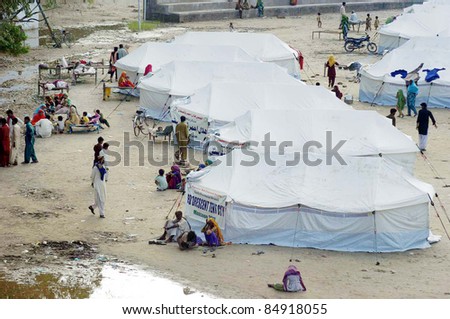 MIRPURKHAS, PAKISTAN - SEPT 18: Rain affected people are living in make-shift tent  houses at a relief camp established in Mirpurkhas on September 18, 2011.