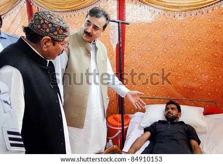 MIRPURKHAS, PAKISTAN - SEPT 18: Prime Minister, Syed Yousuf Raza Gilani visits a field hospital in flood and rain affected in Mirpurkhas District on September 18, 2011.