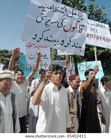QUETTA, PAKISTAN - SEPT 25: Members of Hazara Community pass through a road during protest rally against terrorism and target killings in Balochistan Musa check-post on September 25, 2011in Quetta.