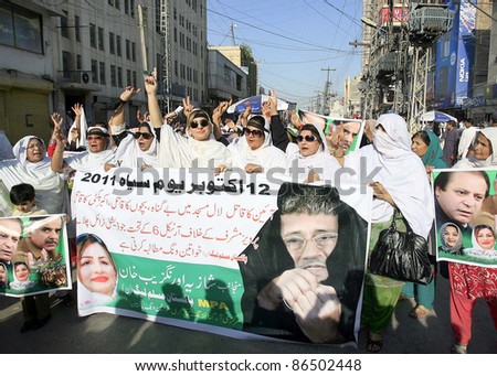 PESHAWAR, PAKISTAN-OCT 12: Supporters of Muslim League-N Women Wing chant slogans during protest rally to mark today as Black Day on October 12, 2011 in Peshawar, Pakistan.
