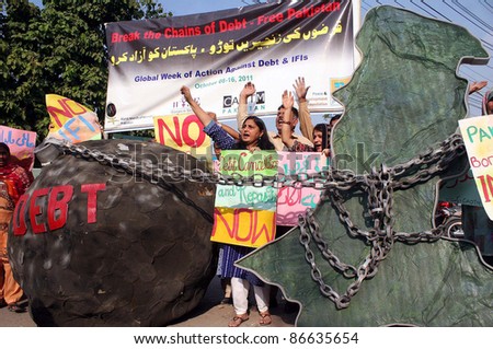LAHORE, PAKISTAN - OCT 14: Activists of Labor Party (LPP) shout slogans against  International Monetary Fund (IMF) during protest demonstration on October 14, 2011 in Lahore, Pakistan.