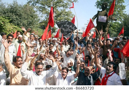 LAHORE, PAKISTAN - OCT 15: Supporters of Railways Workers Union shout slogans in favor of their demands during a protest demonstration at Lahore press club on October 15, 2011 in Lahore.