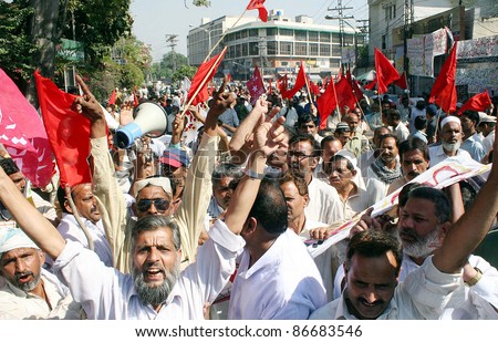 LAHORE, PAKISTAN - OCT 15: Supporters of Railways Workers Union shout slogans in favor of their demands during a protest demonstration at Lahore press club on October 15, 2011 in Lahore.