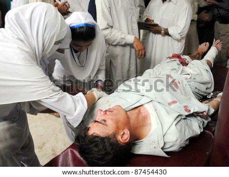 PESHAWAR, PAKISTAN - OCT 26: An injured man who was injured in an explosion, being treated at Lady Reading hospital (LRH) on Wednesday, October 26, 2011in Peshawar.