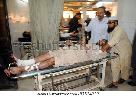 PESHAWAR, PAKISTAN - OCT 27: An injured man, who was injured in explosion at Rampura Bazaar, being treated at Lady Reading hospital (LRH) on October 27, 2011 in Peshawar.