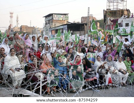 LAHORE, PAKISTAN - OCT 28: Supporters of Muslim League-N chant slogans against President, Asif Ali Zardari during protest rally on Friday, October 28, 2011 in Lahore, Pakistan.