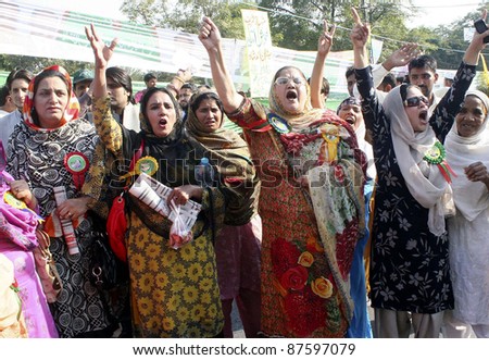 LAHORE, PAKISTAN - OCT 28: Supporters of Muslim League-N shout slogans against President, Asif Ali Zardari during protest rally on October 28, 2011 in Lahore, Pakistan.