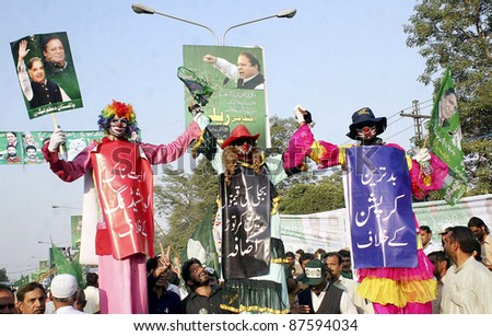 LAHORE, PAKISTAN - OCT 28: Supporters of Muslim League-N pass through a road during protest rally against President, Asif Ali Zardari on Friday, October 28, 2011in Lahore, Pakistan.