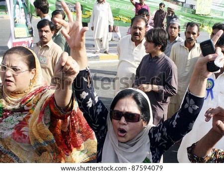 LAHORE, PAKISTAN - OCT 28: Supporters of Muslim League-N shout slogans against President, Asif Ali Zardari during protest rally on Friday, October 28, 2011 in Lahore, Pakistan.