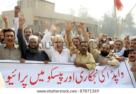 PESHAWAR, PAKISTAN - NOV 01: Supporters of WAPDA Hydro Electric Central Labor Union shout slogans in favor of their demands during protest demonstration on November 01, 2011in Peshawar, Pakistan.