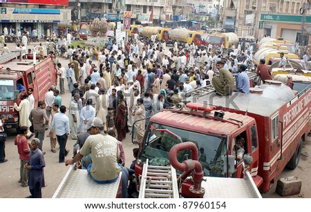 HYDERABAD, PAKISTAN, NOV 02: Town Municipal Administration City employees gather with TMA vehicles as they are protesting against non-payment of their salaries on November 02, 2011in Hyderabad .