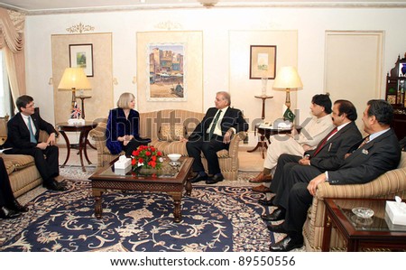 ISLAMABAD, PAKISTAN - NOV 25: Punjab Chief Minister, Shahbaz Sharif talks with UK Home Secretary, Theresa May during meeting on November 25, 2011in Islamabad.