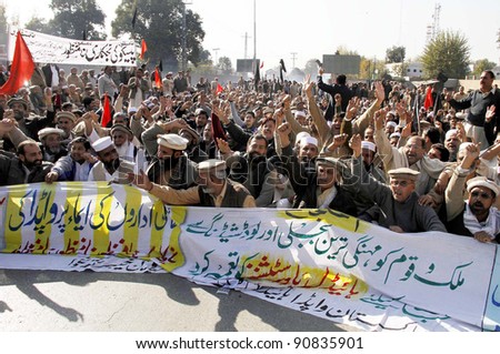 PESHAWAR, PAKISTAN - DEC 14: Supporters of WAPDA Hydro Electric Central Labor Union shout slogans in favor of their demands during protest demonstration at Governor House on December 14, 2011 in Peshawar, Pakistan.