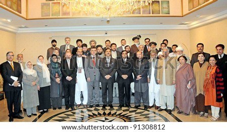 ISLAMABAD, PAKISTAN - DEC 21: A group photo of Prime Minister, Syed Yousuf Raza Gilani with Afghan Parliamentary Delegation during meeting at PM House in Islamabad on December 21, 2011.