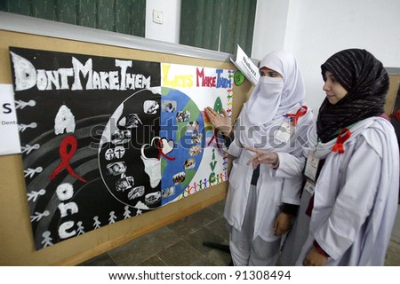 PESHAWAR, PAKISTAN - DEC 22: Students look a chart during a program about AIDS held at Peshawar Medical College on Thursday, December 22, 2011.