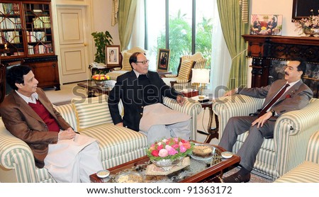 ISLAMABAD, PAKISTAN - DEC 23: Prime Minister, Syed Yousuf Raza Gilani in meeting with Muslim League-Q President, Ch.Shujaat Hussain and Senior Federal Minister, Ch.Pervez Elahi on December 23, 2011.