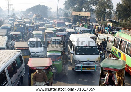LAHORE, PAKISTAN, DEC 30: A large number of vehicles stuck in traffic jam at Minar-e-Pakistan road in Lahore on Friday, December 30, 2011.