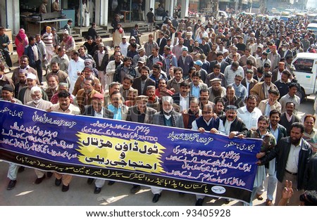 HYDERABAD, PAKISTAN - JAN 23: Supporters of WAPDA Hydro Electric Central Labor Union chant slogans in favor of their demands during protest rally  on January 23, 2012 in Hyderabad.