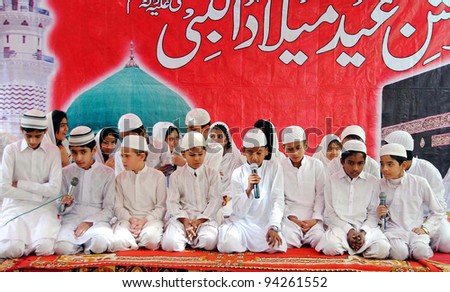 HYDERABAD, PAKISTAN - FEB 03: Students recite Naat during Mehfil-e-Milad program in the connection of  Eid Milad-un-Nabi (SAW) held at Royal Cambridge School on February 03, 2012 in Hyderabad, Pakistan.