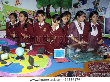 HYDERABAD, PAKISTAN - FEB 07: Unidentified School children participate in Computer exhibition held at City Cambridge High School on February 07, 2012 in Hyderabad.