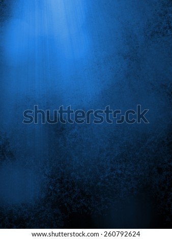 blue background with dark black shadows, soft faint white bokeh lights and rays or beams of light, sunshine coming down from heaven in streaks through the clouds