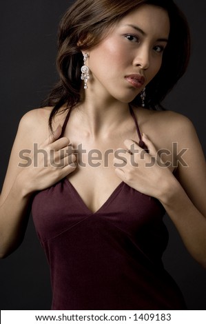 A beautiful asian model in velvet evening dress