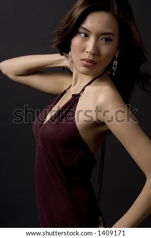 A beautiful asian model in an evening dress