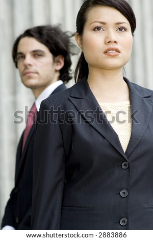Two business professionals looking ahead (shallow depth of field used)